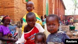 Internally displaced children, who are escaping the violence, pose at Bangui's Saint Paul's Church December 17, 2013. Some European countries will send troops to support a French-African mission to restore order in Central African Republic, French Foreign