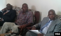 New War Veterans Minister Tshinga Dube (far left) seen here with fired minister Christopher Mutsvangwa on the day war veterans were engaged in street skirmishes with police in Harare.