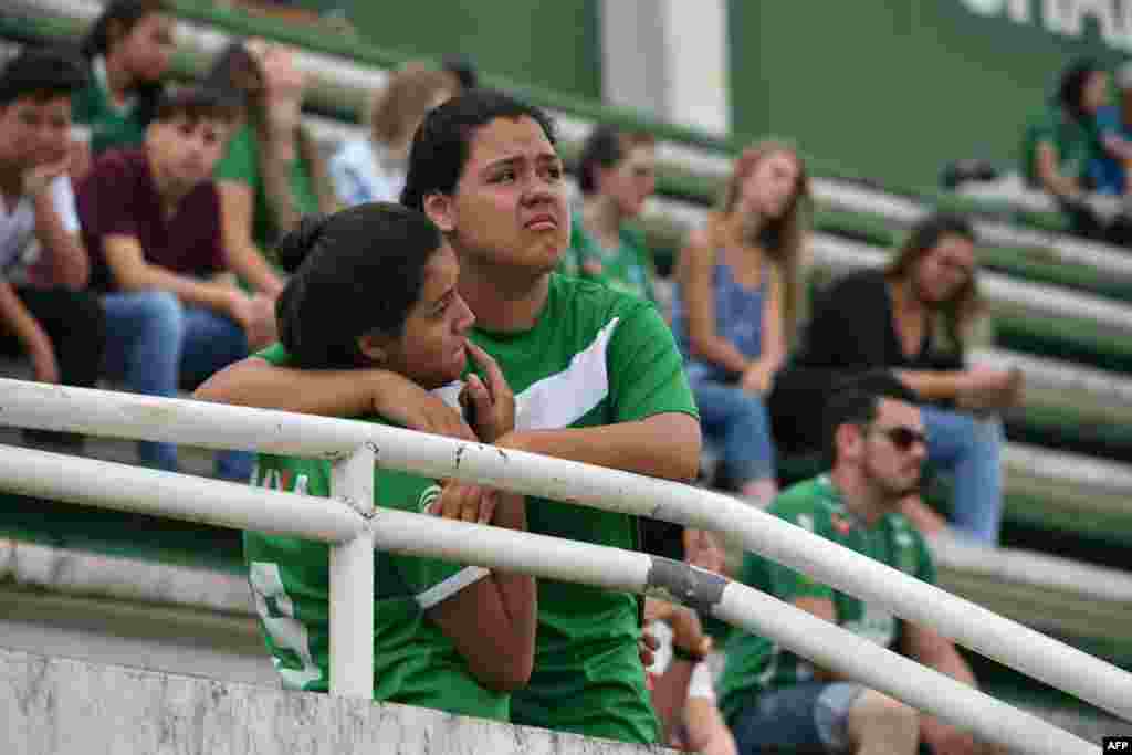 People pay tribute to the players of Brazilian team Chapecoense Real who were killed in a plane accident in the Colombian mountains, at the club&#39;s Arena Conda stadium in Chapeco, in the southern Brazilian state of Santa Catarina.