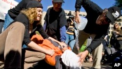 FILE - Protestors demonstrate the use of waterboarding in front of the Justice Department in Washington. 