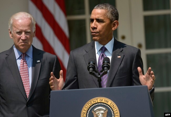 FILE - U.S. President Barack Obama, right, alongside Vice President Joe Biden, speaks in the Rose Garden of the White House in Washington, July 1, 2015.