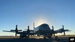 In this photo provided by the New Zealand Defense Force, an Orion aircraft is prepared at a base in Auckland, New Zealand, Jan. 17, 2022, before flying to assist the Tonga government after the eruption of an undersea volcano. 