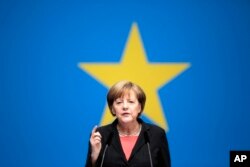 German Chancellor Angela Merkel delivers her keynote speech during the German ruling Christian Democratic Union party's convention ahead of the European Parliament elections in Berlin, April 5, 2014.