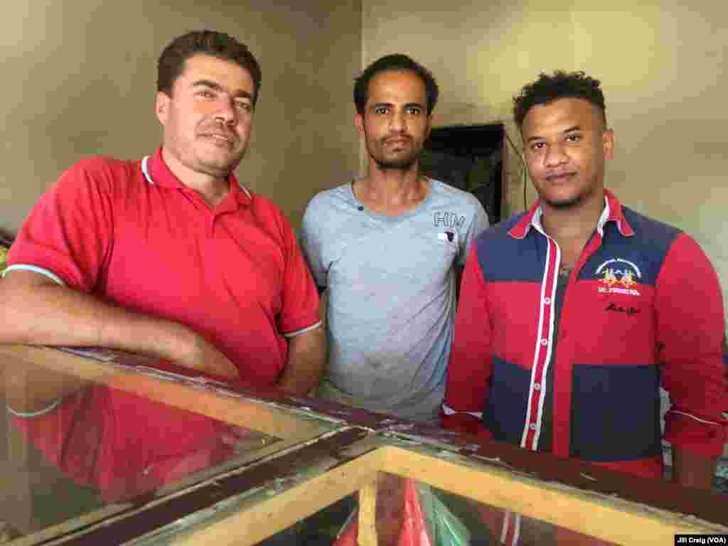 Syrian refugee and bakery owner Abdulrahman Darwish, left, is shown with two Yemeni refugee workers at his bakery in Hargeisa, Somaliland, March 30, 2016.