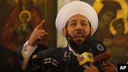 Syrian Mofti Ahmad Hassoun speaks during a mass at the Holy Cross Church, in Damascus, Syria.(file)