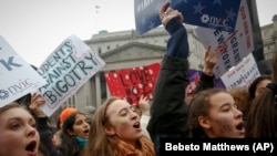 High school and college students protest in New York's Foley Square during a rally against President Donald Trump's executive order banning travel from seven Muslim-majority nations.