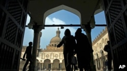 FILE - Muslims arrive to attend the Friday prayer at Al-Azhar mosque in Cairo, Egypt, Dec. 28, 2012. 