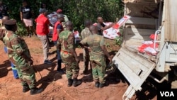Zimbabwe army lorry stuck in muddy road while carrying relief aid to remote parts of Chimanimani, district, March 24, 2019. (C Mavhunga/VOA)