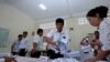 FILE - Members of the National Election Committee count ballots during a Senate election in Phnom Penh, Cambodia, Feb. 25, 2018. The committee was one of several organizations apparently caught up in a recent cyberattack engineered by the Chinese government, investigators allege.