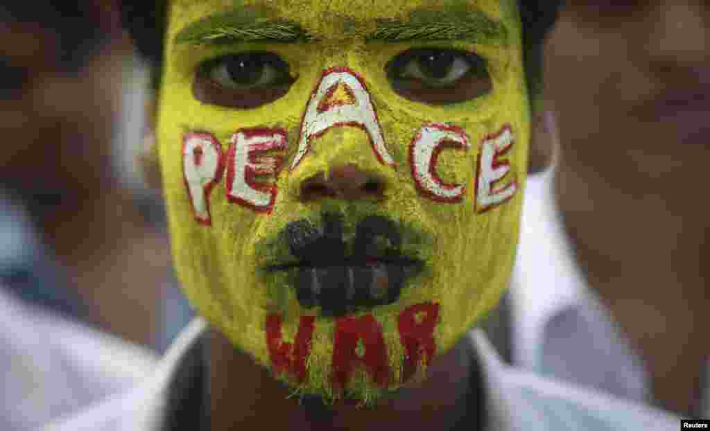 A student participates in a peace rally to commemorate the 68th anniversary of the atomic bombings of the Japanese cities of Hiroshima and Nagasaki, in Mumbai, August 6, 2013. 