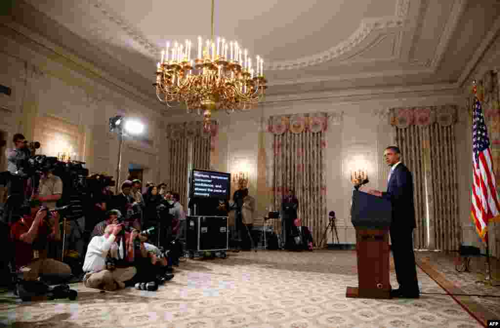 August 8: U.S. President Barack Obama delivers a statement on the lowering of the U.S. credit rating and the Afghan helicopter crash in the State Dining Room of the White House. REUTERS/Jason Reed