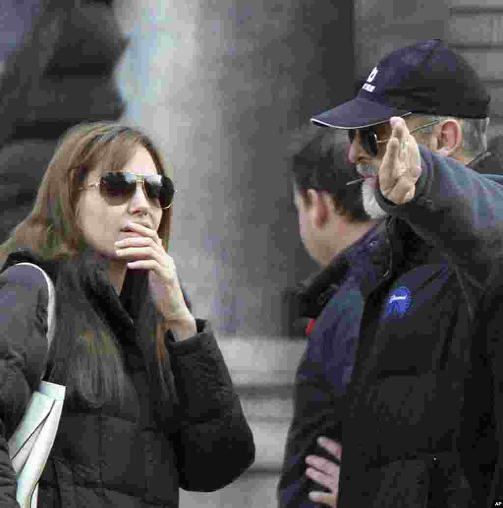 Angelina Jolie talks to cast members during the filming of her movie in central Budapest October 13, 2010. The film was shot partly in Hungary and in Bosnia. (REUTERS)