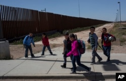 Columbus Elementary School students, cross the border from Columbus, New Mexico, U.S., into Palomas, Mexico, after a day of school, March 31, 2017.