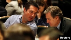 U.S. Representative Devin Nunes (R-CA), chairman of the House Freedom Caucus, listens as President Donald Trump addresses the Republican congressional retreat at the Greenbrier resort in White Sulphur Springs, West Virginia, Feb. 1, 2018.