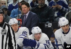 Toronto Maple Leafs coach Mike Babcock looks on during the first period of an NHL hockey game against the Buffalo Sabres, April 3, 2017, in Buffalo, New York.