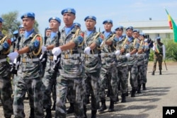 FILE - Chinese soldiers of the U.N. Mission in South Sudan march as they celebrate the International Day of United Nations Peacekeepers, May 29, 2017, in Juba.