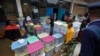 Electoral workers stand by ballot boxes stacked at a collection center in Nairobi, Kenya, Aug. 9, 2017. 