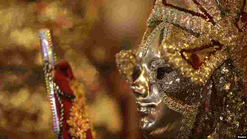 A boy dressed up as Sao Jorge, also known as Saint George, attends Sao Jorge's day celebrations in Rio de Janeiro, Brazil.