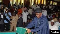 Nigeria's President Goodluck Jonathan presents the 2013 budget proposal at a joint sitting of the parliament in the capital Abuja October 10, 2012. 