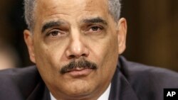 FILE - Attorney General Eric Holder testifies on Capitol Hill in Washington before the Senate Judiciary Committee hearing oversight hearing on the Justice Department. 