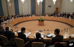 FILE - Participants attend a conference on Afghanistan bringing together representatives of Afghan authorities and the Taliban in Moscow, Russia, Nov. 9, 2018.