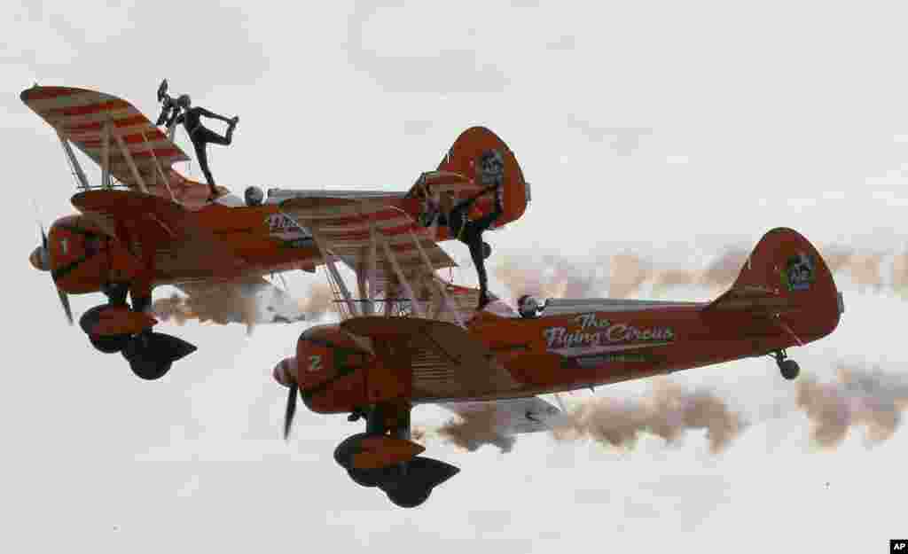 British female members of the Aerosuperbatics Wingwalkers, perform aerobatic stunts for the first time in the Philippines during the four-day 22nd International Hot Air Balloon festival at Clark, Pampanga province north of Manila, Philippines, Feb. 8, 201