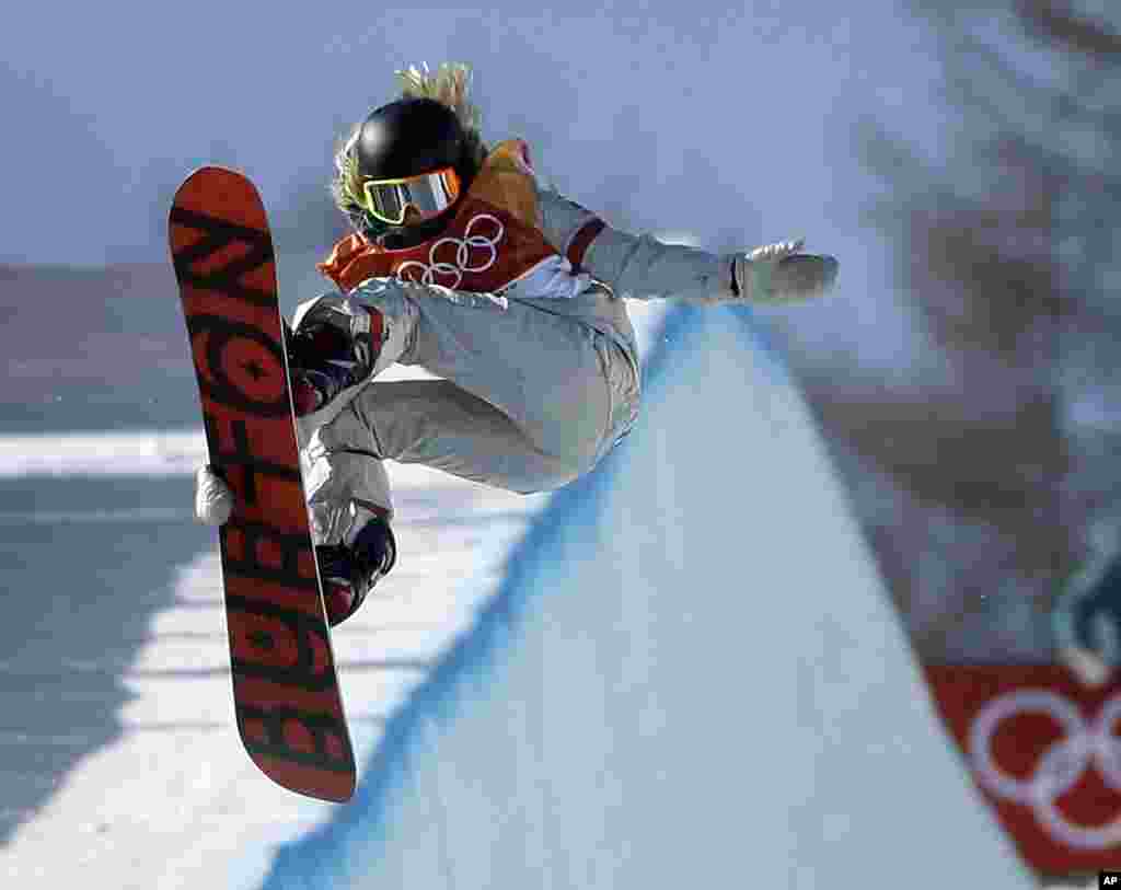 Chloe Kim, of the United States, jumps during the women's halfpipe finals at Phoenix Snow Park at the 2018 Winter Olympics in Pyeongchang, South Korea, Feb. 13, 2018.