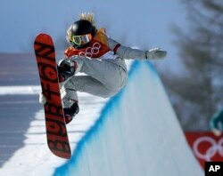 Chloe Kim, of the United States, jumps during the women's halfpipe finals at Phoenix Snow Park at the 2018 Winter Olympics in Pyeongchang, South Korea, Feb. 13, 2018.