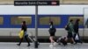 People walk on a platform to take a train, at the Saint-Charles railway station, in Marseille, southern France, June, 1, 2016. 