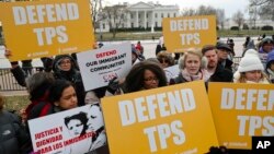 FILE - CASA de Maryland, an immigration advocacy and assistance organization, holds a rally in Lafayette Park, across from the White House in Washington.