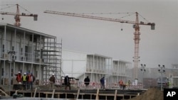 FILE - Workers are seen at an area under construction at the U.S. embassy in Kabul, Afghanistan, April 4, 2012.
