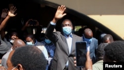 Opposition UPND party's presidential candidate Hakainde Hichilema waves to supporters after casting his ballot in Lusaka, Zambia, August 12, 2021. REUTERS/Jean Ndaisenga 