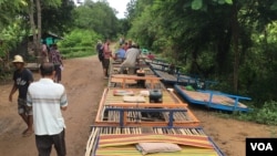 Some bamboo trains are in line for departure, in Battambang, on July 21, 2017. (Sun Narin/VOA Khmer)