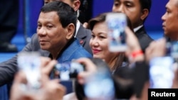 Philippine President Rodrigo Duterte arrives at an event with Filipino community in Hong Kong, April 12, 2018.