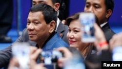 Philippine President Rodrigo Duterte arrives at an event with Filipino community in Hong Kong, April 12, 2018. Philippine President Rodrigo Duterte has threatened to arrest an International Criminal Court (ICC) prosecutor if she conducts activities in his country.