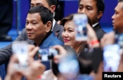 Philippine President Rodrigo Duterte arrives at an event with Filipino community in Hong Kong, April 12, 2018.