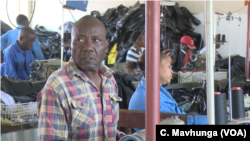 A worker protective clothing factory in Harare at one of the companies which have not closed, but they say President Emmerson Mnangagwa must address the issue of ever losing value bondnotes, Oct. 29, 2018.