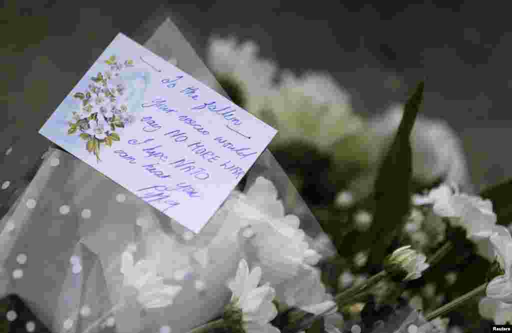 Flowers and a message placed at the cenotaph in Newport, Wales Sept. 4, 2014.