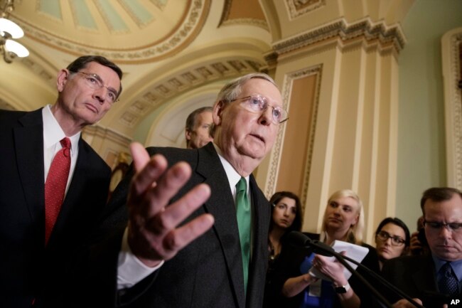 Senate Majority Leader Mitch McConnell of Ky., joined at left by Sen. John Barrasso, R-Wyo., speaks with reporters after meeting with Vice President Mike Pence as Republicans roll out their Obamacare replacement plan, March 7, 2017.