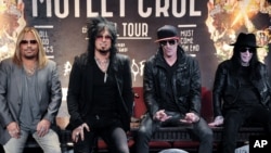 From left, Vince Neil,Nikki Sixx, Tommy Lee, and Mick Mars seen at Motley Crue Press Conference, Jan. 28, 2014, in Los Angeles.