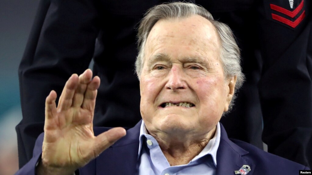 FILE - Former U.S. President George H.W. Bush arrives on the field to do the coin toss ahead of the start of Super Bowl LI between the New England Patriots and the Atlanta Falcons in Houston, Texas, Feb. 5, 2017.