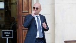 FILE - In this Nov. 29. 2019 file photo, Maltese businessman Yorgen Fenech, leaves court after being questioned in the 2017 bomb blast that killed investigative journalist Daphne Caruana Galizia as she drove near her home, in Valletta, Malta.