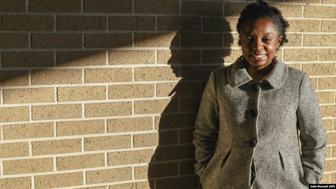 Joycelyn Davis, a direct descendant of slave ship Clotilda survivor Charlie Lewis, stands for a portrait at the community center in Africatown in Mobile, Ala.