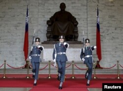 Guards of honor parade at the Chiang Kai-shek Memorial Hall in Taipei, Taiwan, Jan. 17, 2016.