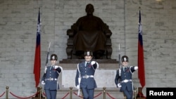 FILE - Guards of honor parade at the Chiang Kai-shek Memorial Hall in Taipei, Taiwan, Jan. 17, 2016. 