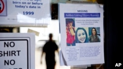 A missing poster for Ashley HeavyRunner Loring is posted to the entrance of a grocery store on the Blackfeet Indian Reservation in Browning, Mont., July 12, 2018.