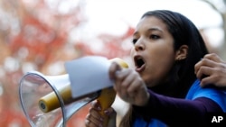 Rutgers University junior Carimer Andujar, of the Dominican Republic, speaks at a protest against some of President-elect Donald Trump's policies at Rutgers University, Nov. 15, 2016, in New York.