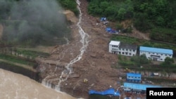 An aerial view shows that buildings at a hydroelectric power station under construction that were hit by landslide in Sanming, Fujian province, China, May 8, 2016. 