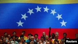 Freddy Guevara, center, first Vice-President of the National Assembly and lawmaker of the Venezuelan coalition of opposition parties (MUD), talks to the media during a news conference in Caracas, Venezuela, July 17, 2017.