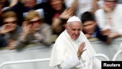 Pope Francis waves as he leaves at the end of a Jubilee mass in Saint Peter's Square at the Vatican, April 3, 2016. 